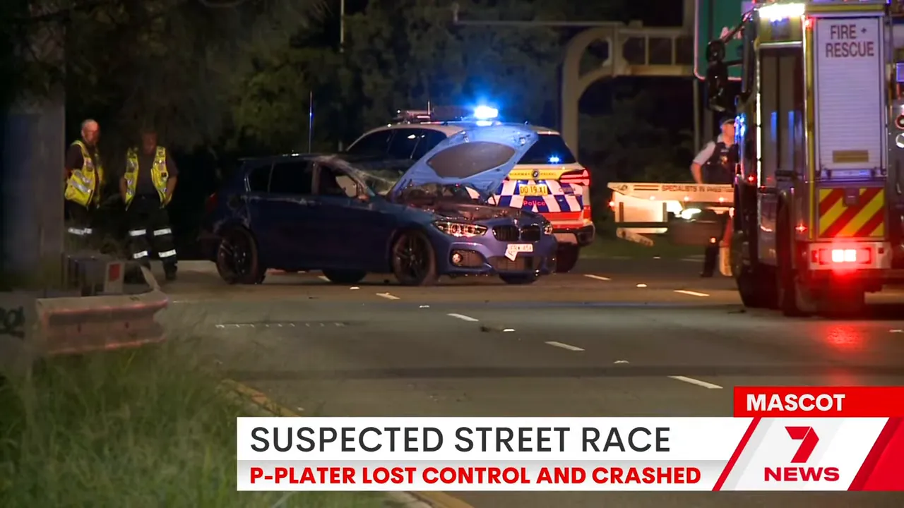 Damaged cars at the roadside with police and emergency vehicles after a suspected street race near Sydney Airport