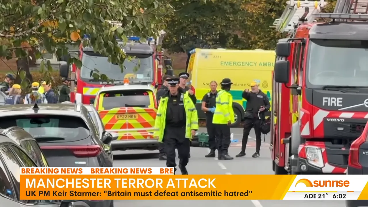 Forensic crews working at the Manchester crime scene during the evening