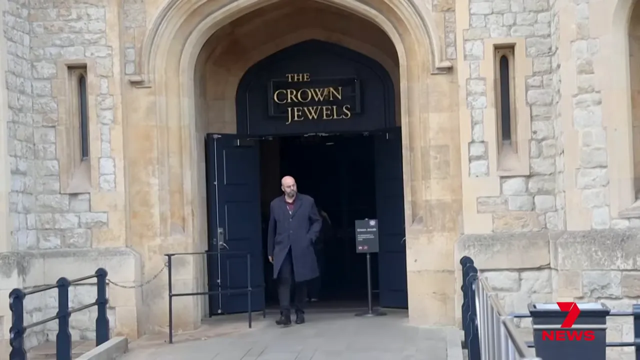 entrance to the Crown Jewels at the Tower of London with open doors and signage