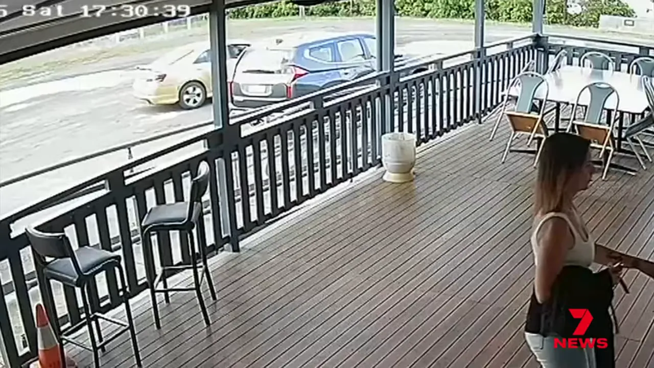 A black SUV pulling into the bowls club car park