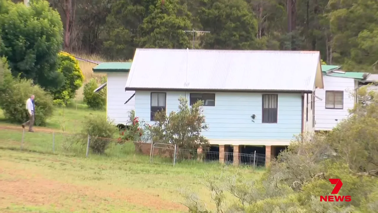 Police examining a vehicle where a sawed-off shotgun and ammunition were found