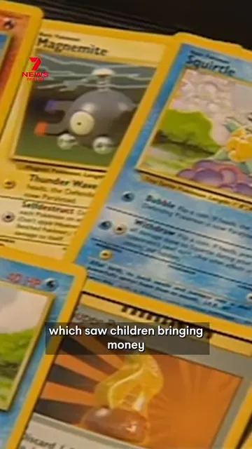 Spread of vintage Pokémon trading cards on a table with a news logo and subtitle about children bringing money.