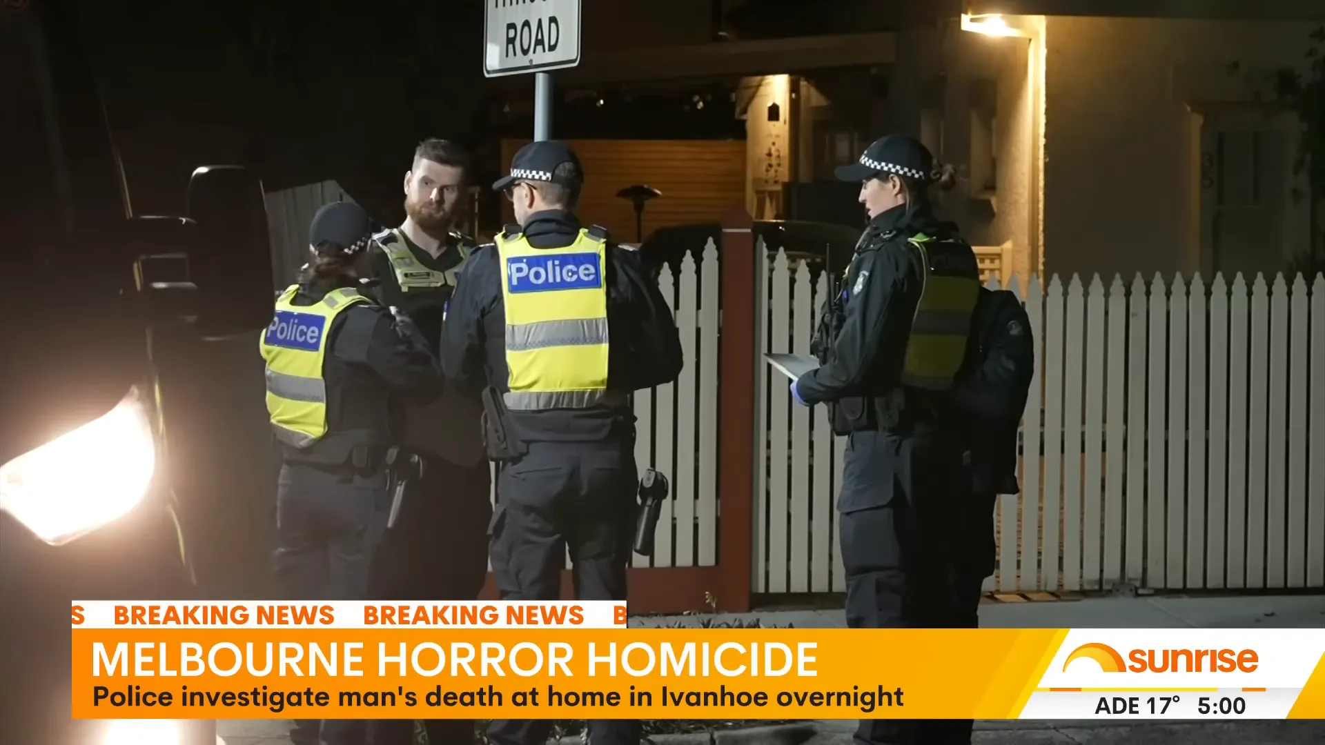 Police tape and officers outside a house on Lyndon Avenue, Ivanhoe