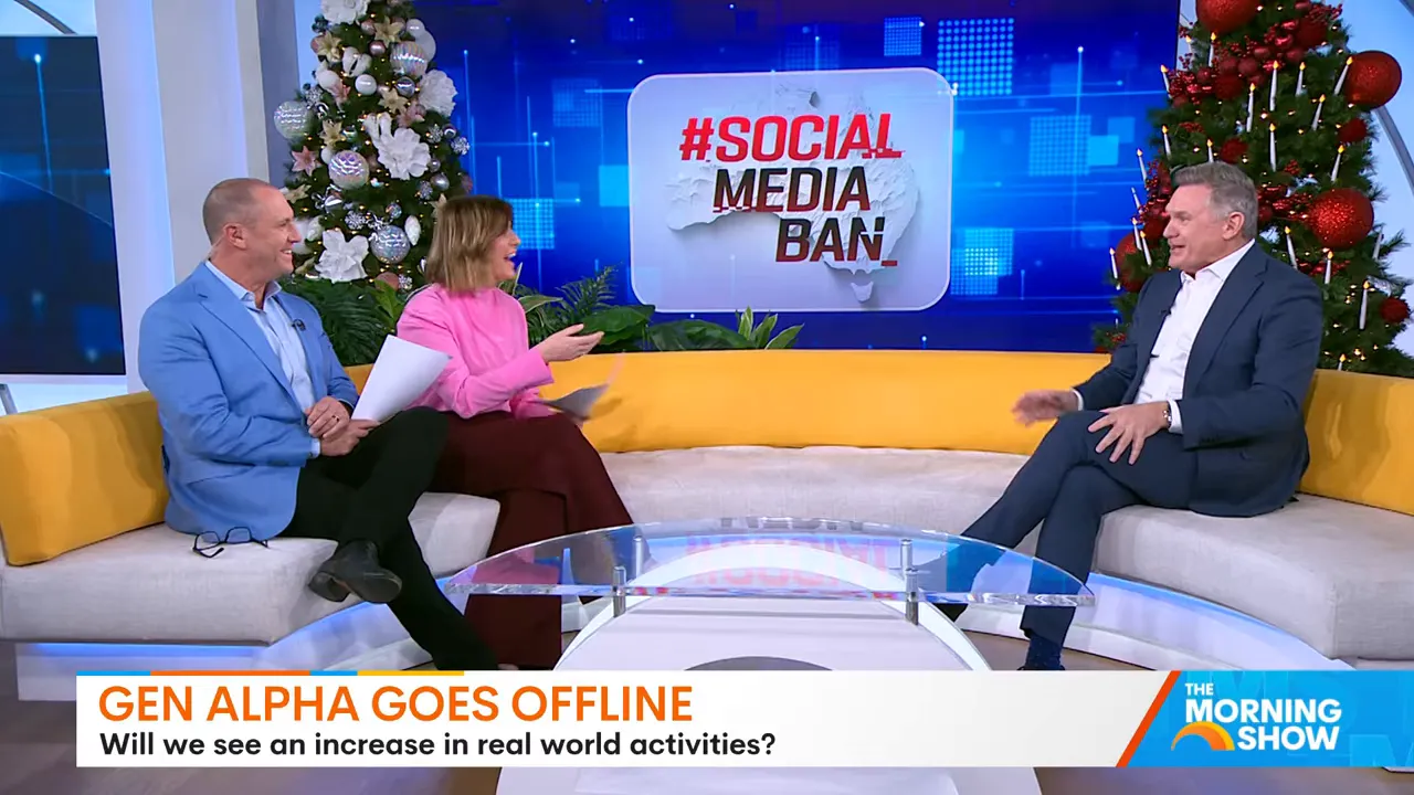 Three presenters on a morning show couch with a '#Social Media Ban' graphic on the screen behind them