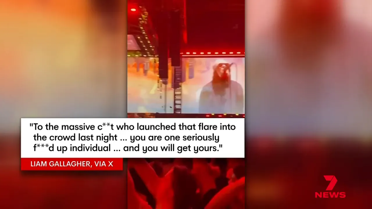 Liam Gallagher looking back angrily on stage