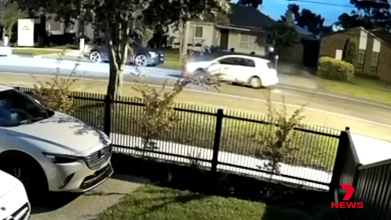 CCTV still showing a white hatchback arriving on the street outside the Altona North house