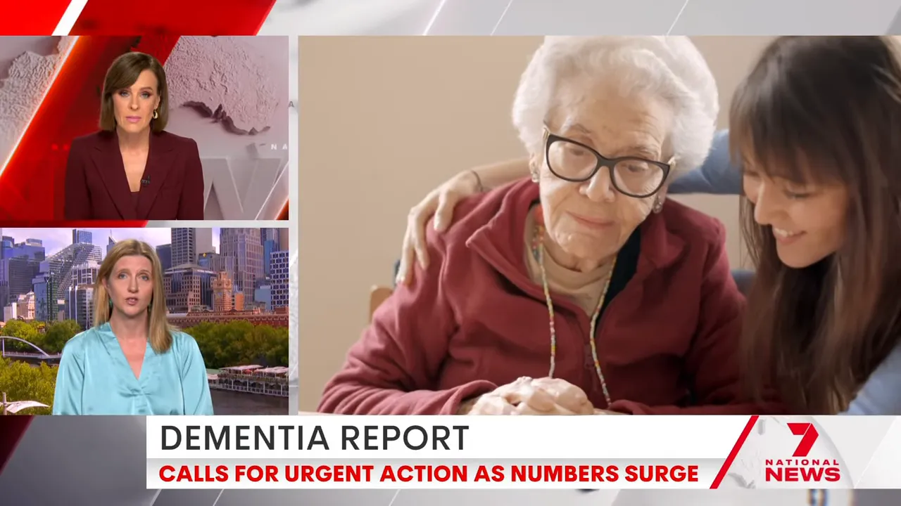 Elderly person being comforted by a caregiver at a table, illustrating dementia care and support.