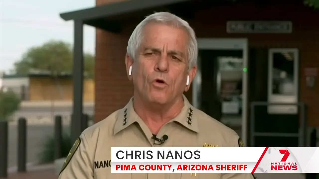 Close-up of a law-enforcement official speaking on camera with a news chyron.