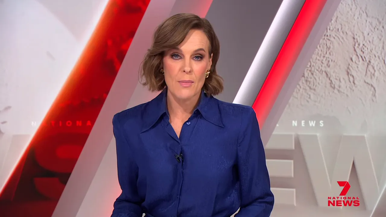 News presenter centered on screen in blue blouse with studio graphics and network logo