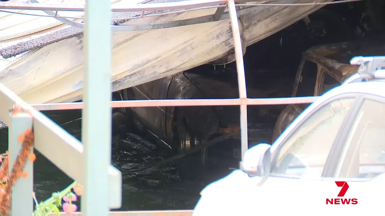 Destroyed cars outside the damaged Eltham home