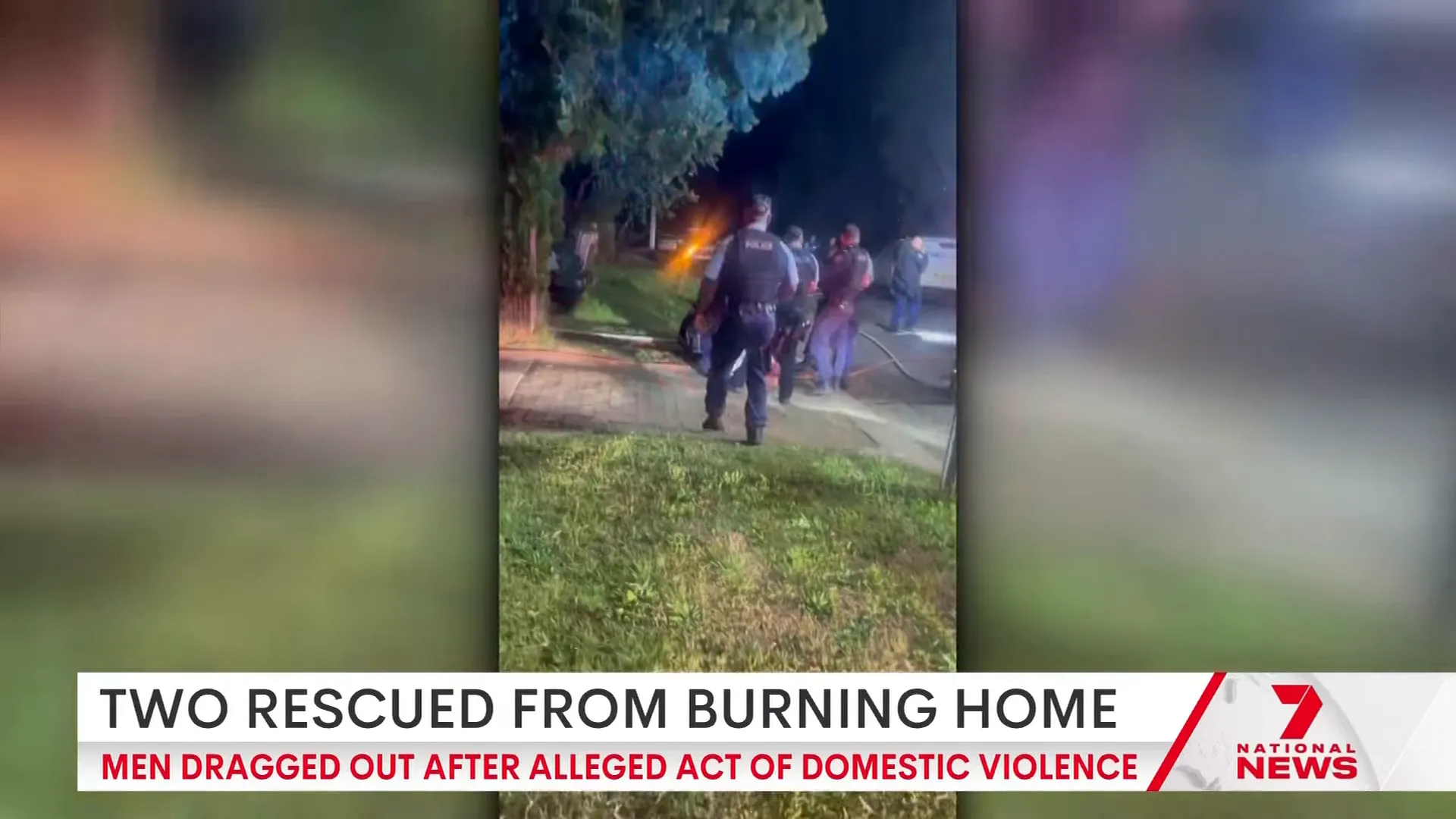 Police officers escorting men to safety