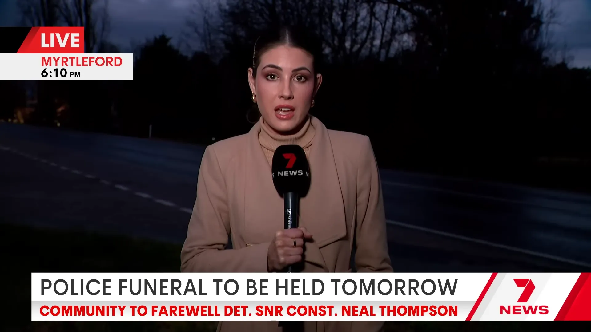 Police officers preparing for a funeral service and guard of honour