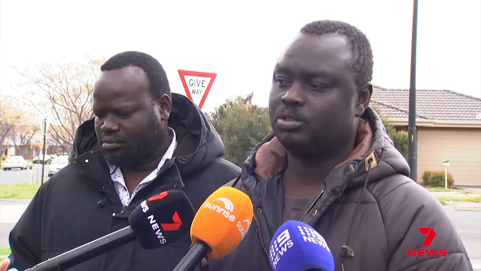 Family and neighbours at the scene mourning the victims