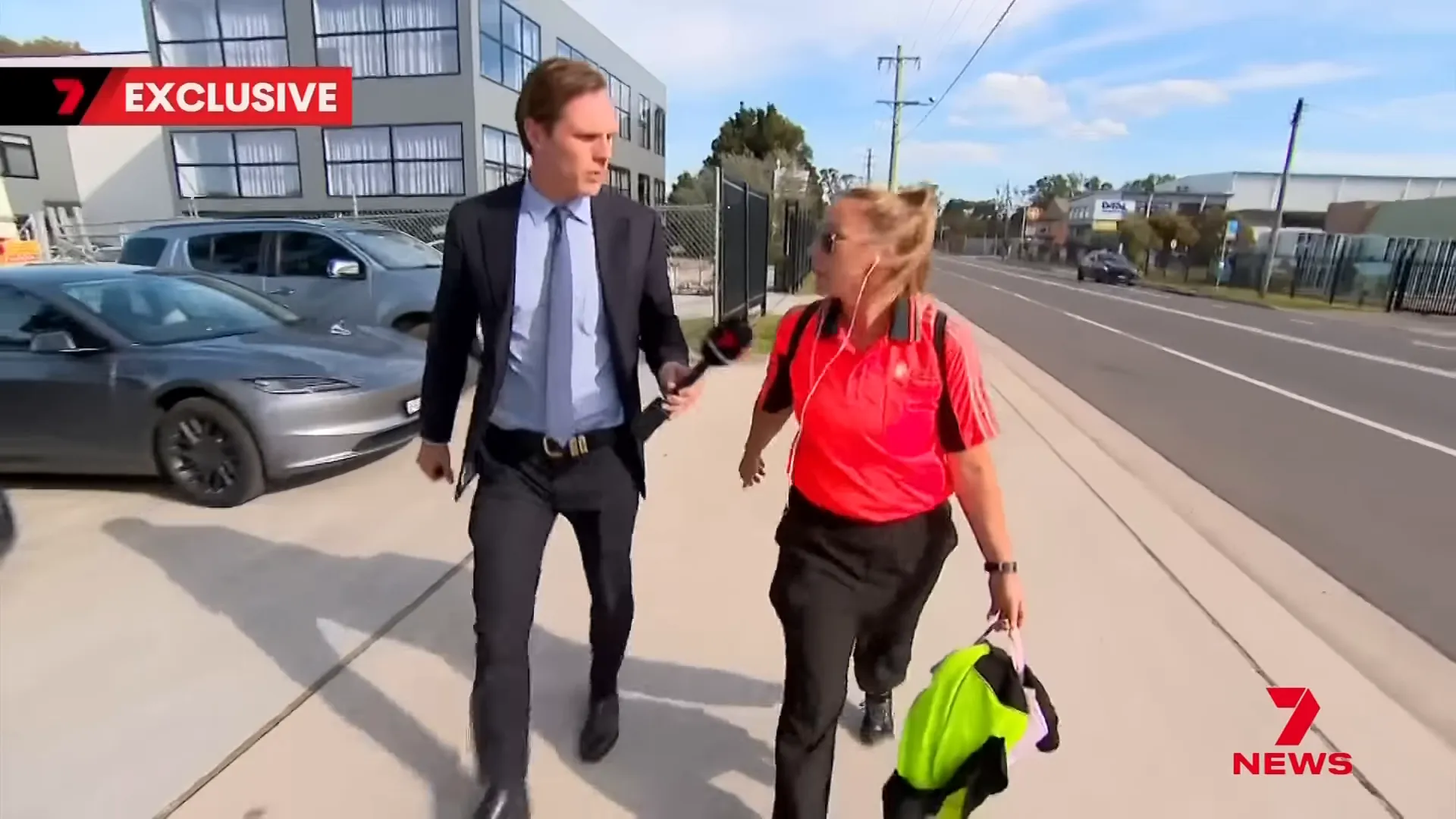 Keli Lane walking between job and prison, answering reporters' questions