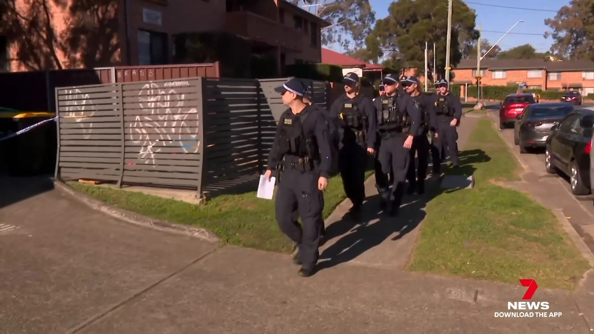 Public order and riot squad officers aiding search