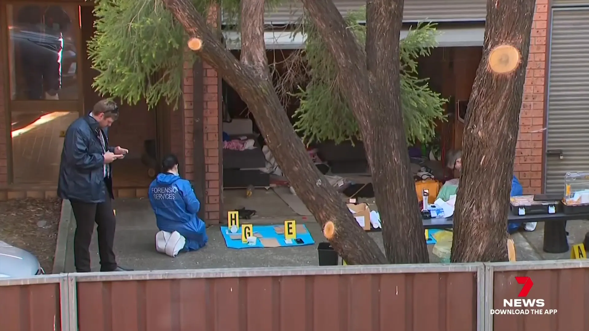 Police and forensic teams searching apartment and garage