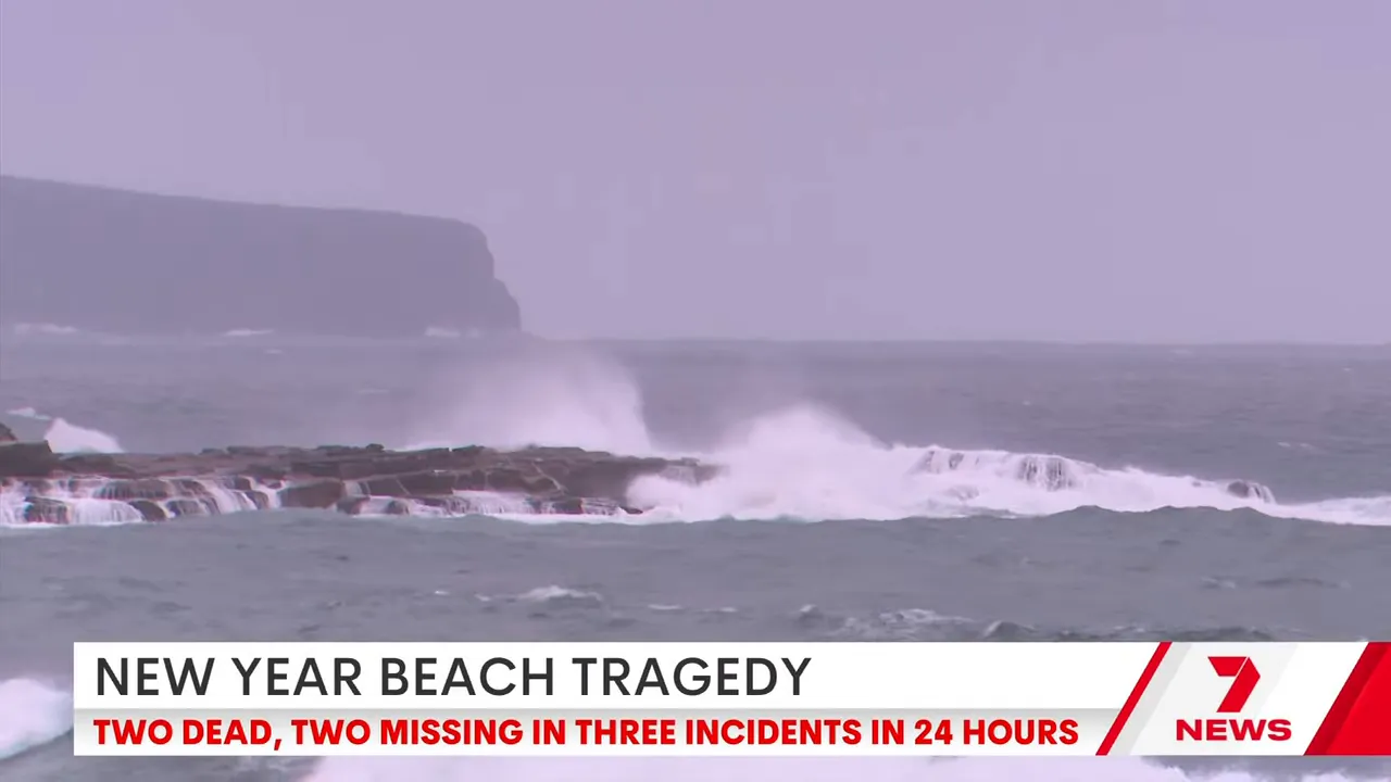 Large waves breaking over rocks and rock pools with spray rising