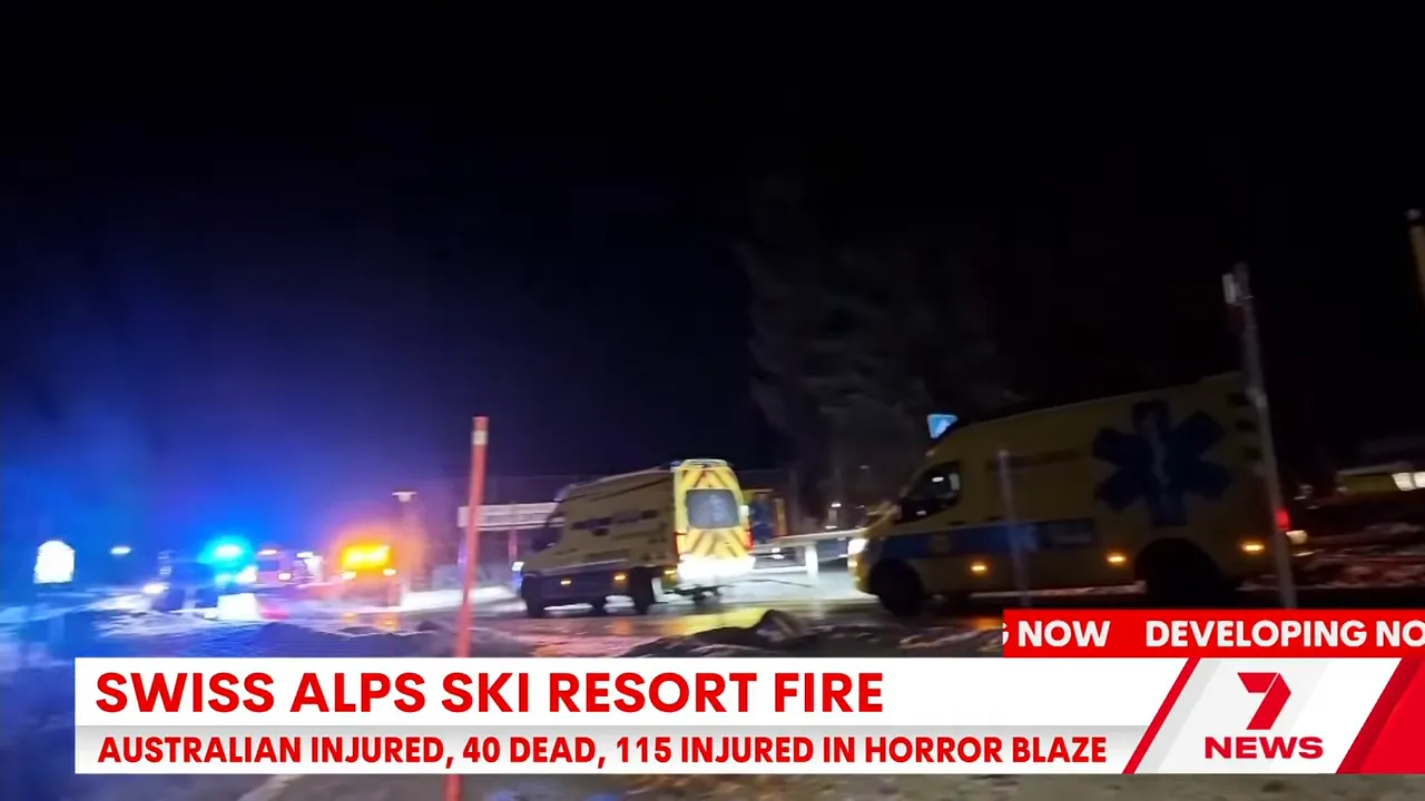 Night view of several yellow ambulances and flashing emergency lights at the scene of the Crans‑Montana incident