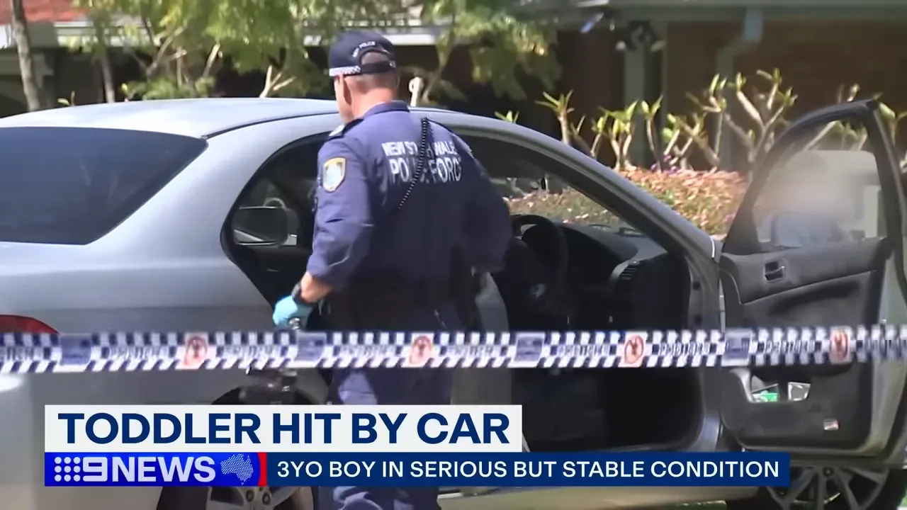 Emergency services at the scene after a toddler was struck by a reversing car