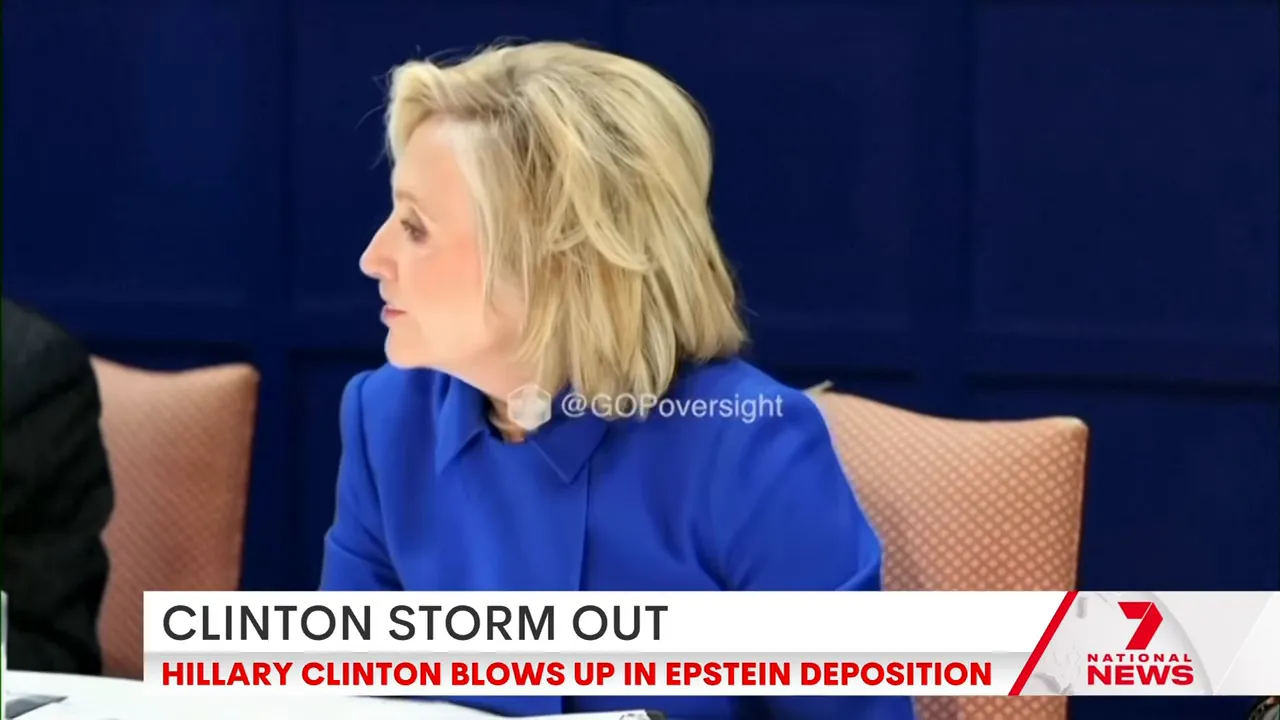 Side-profile of a woman in a blue jacket reacting at a hearing table, captured in a sharp, high-quality frame.