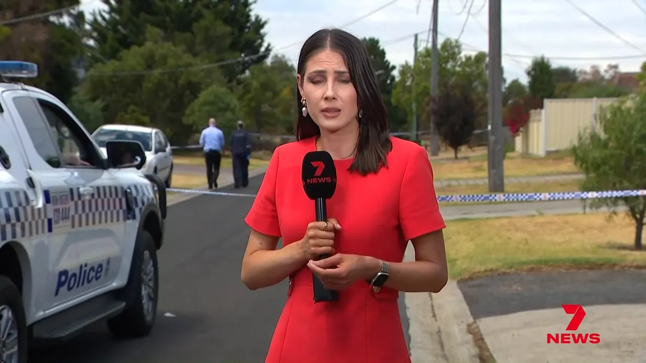 Reporter at the Wyndham Vale crime scene with a police vehicle and detectives visible behind police tape