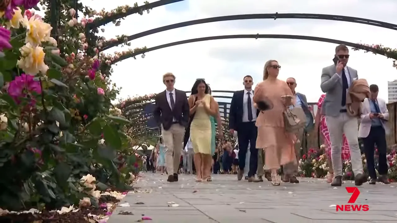 Crowd arriving at Flemington in colourful outfits