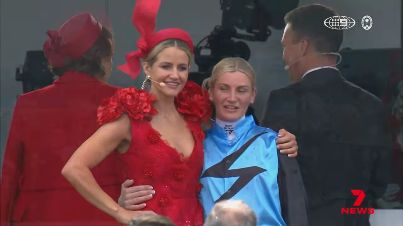 Jamie Melham celebrating the Caulfield and Melbourne Cup double