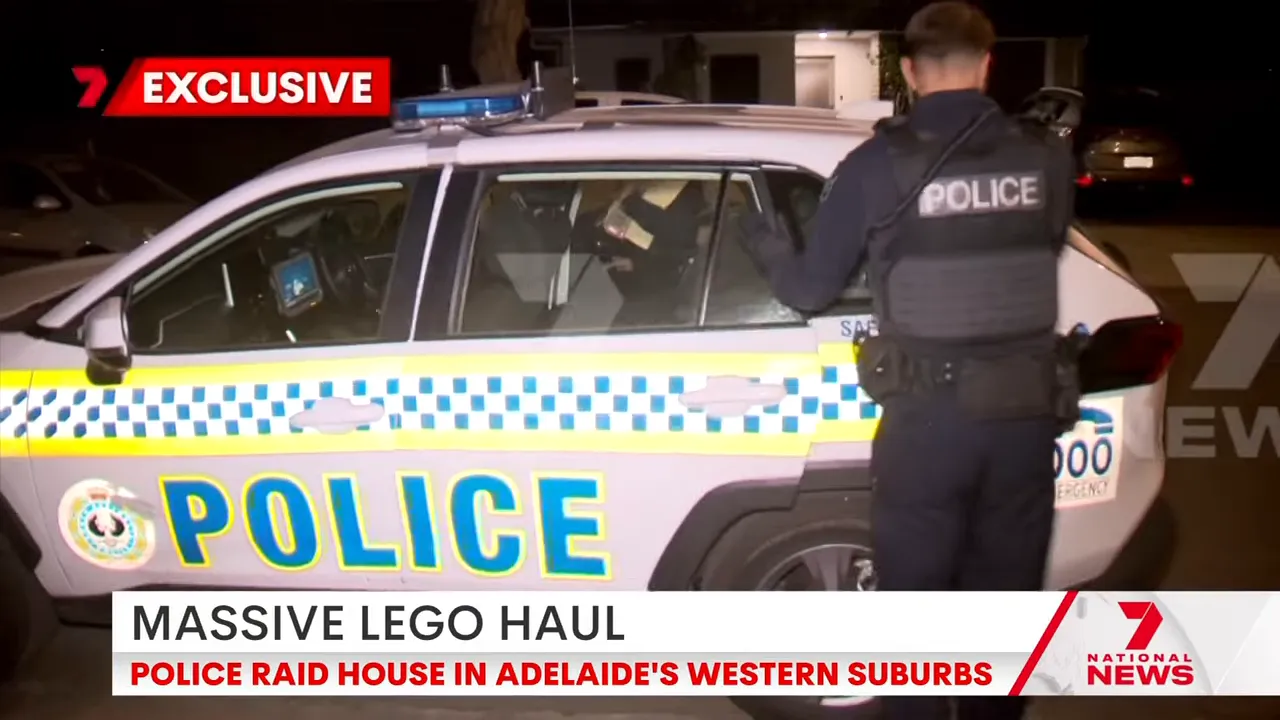 Police vehicle outside Adelaide western suburbs home during Lego raid