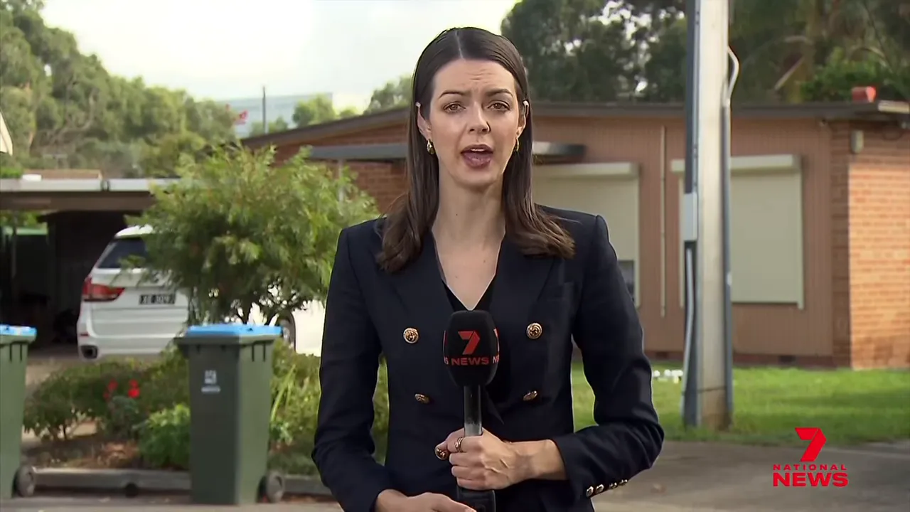 National News presenter speaking outside a western suburbs Adelaide home during Lego raid