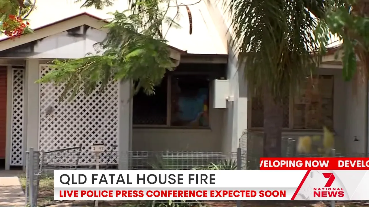 Emergency personnel assisting women after escaping the fire