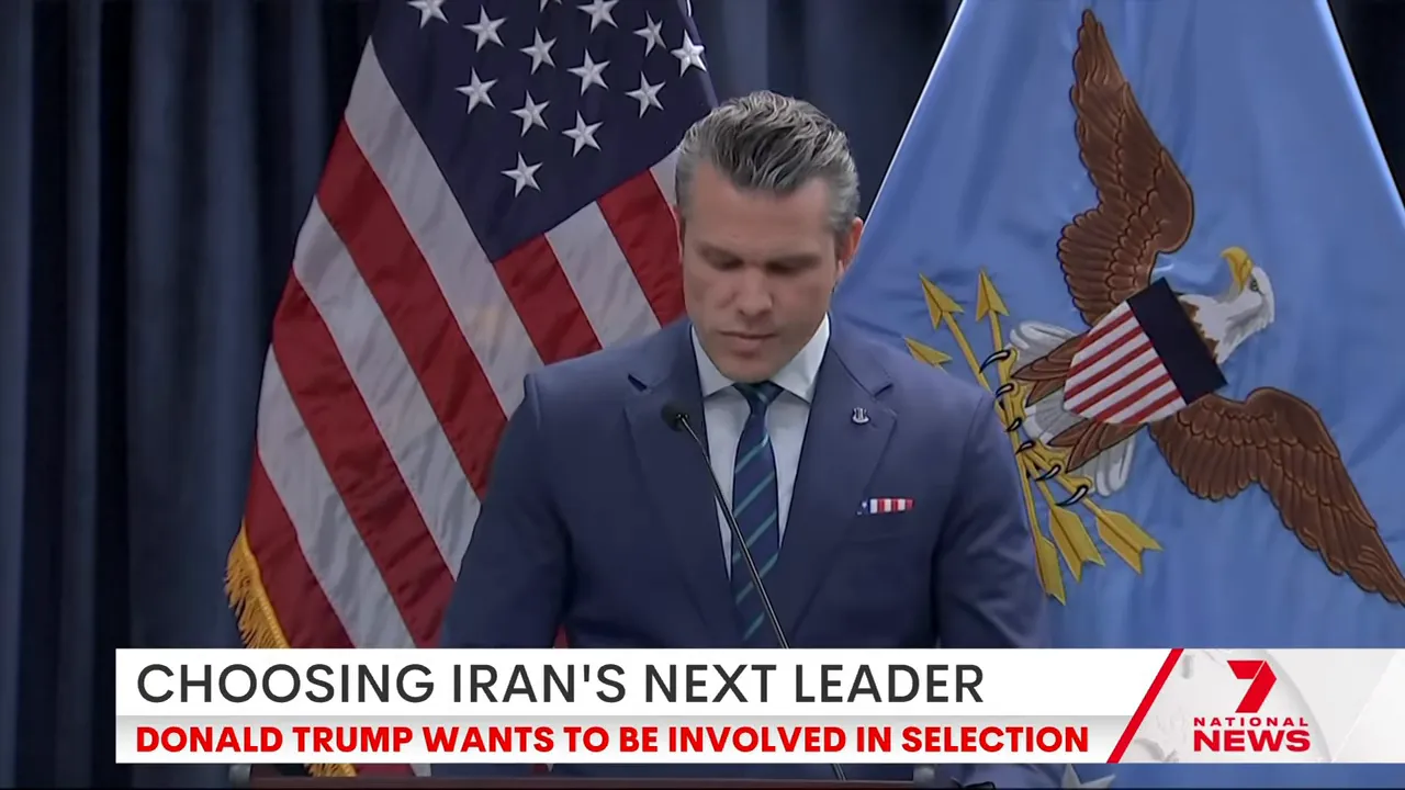 Senior US official speaking at a podium with American and military flags in the background