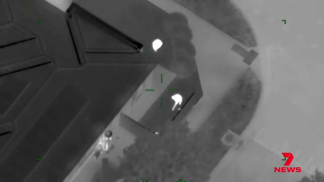 Driver running from police near a front yard