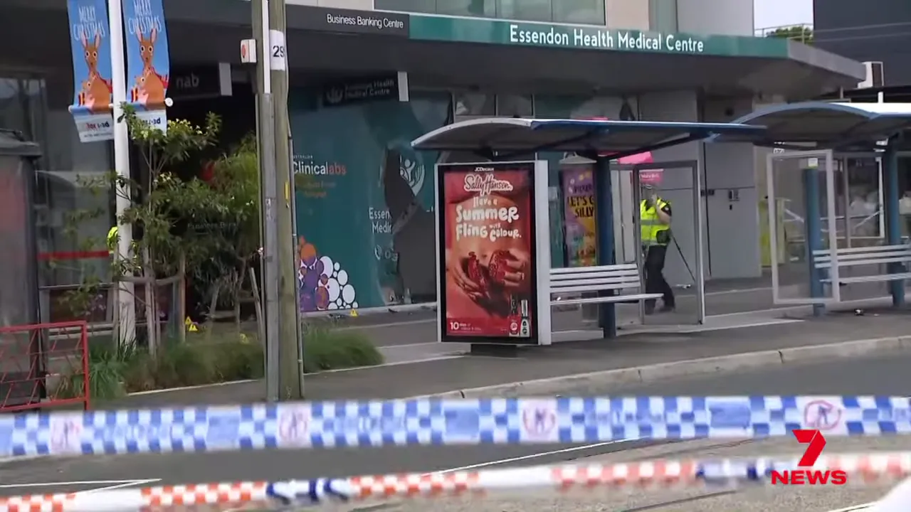 Essendon Health Medical Centre frontage with visible damage, police tape and a cordoned-off tram stop