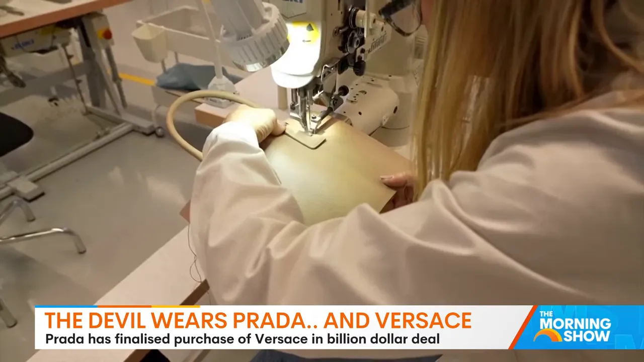 Close-up of a sewing machine stitching leather with an artisan's hands guiding the material