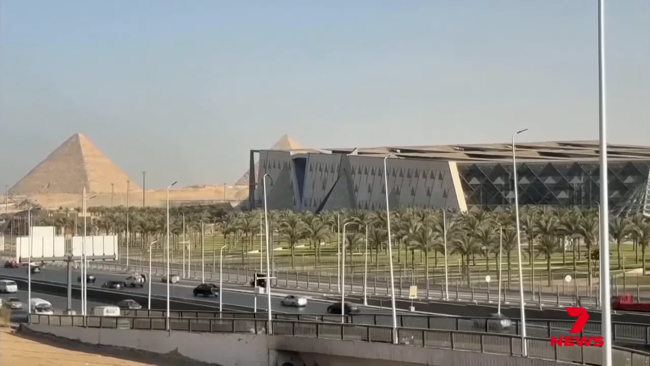 Exterior view of the museum with the pyramids in the background