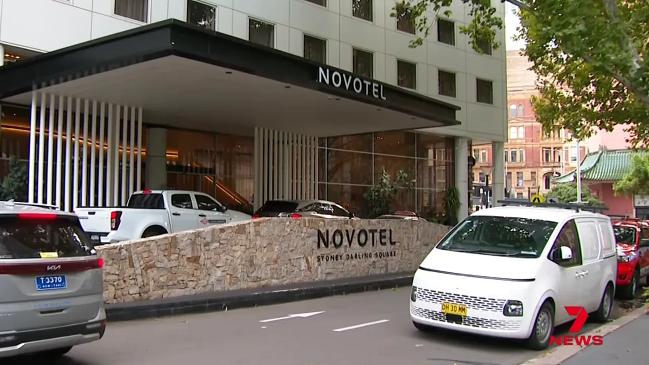 Exterior shot of Novotel Sydney Darling Square showing the hotel entrance and the street outside