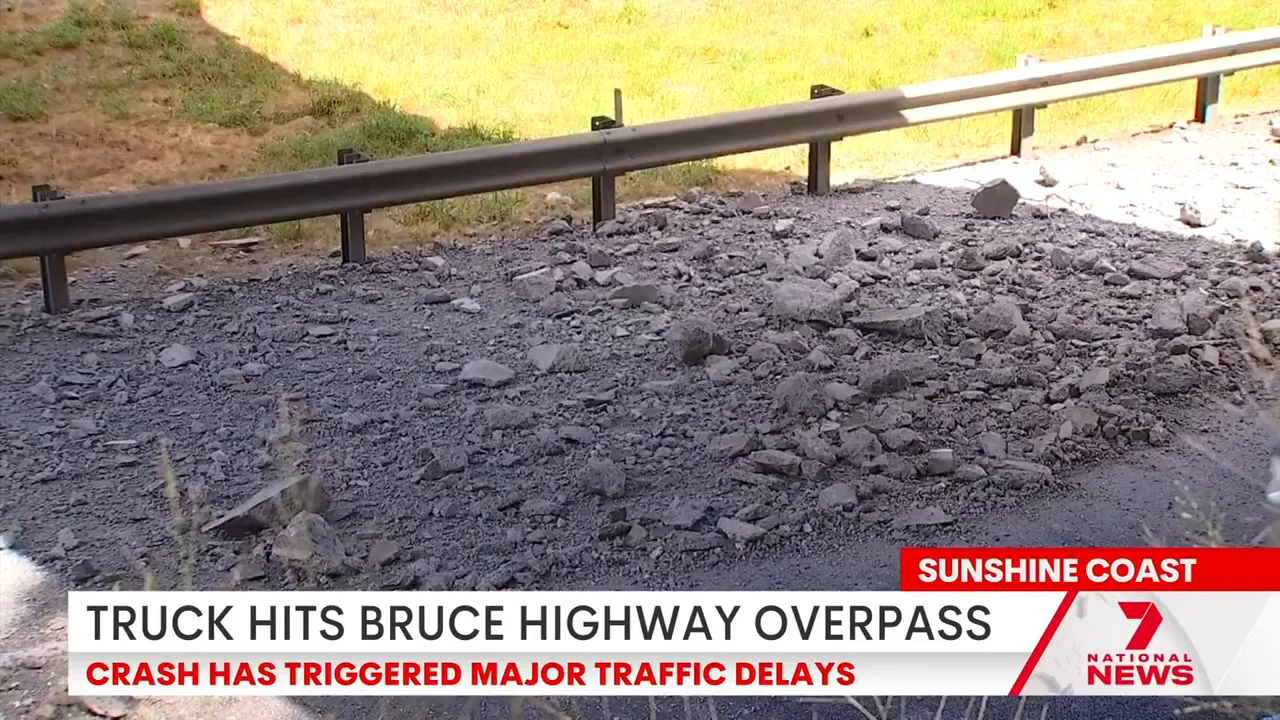 Concrete rubble and damaged guardrail on the Bruce Highway southbound after an overpass was struck
