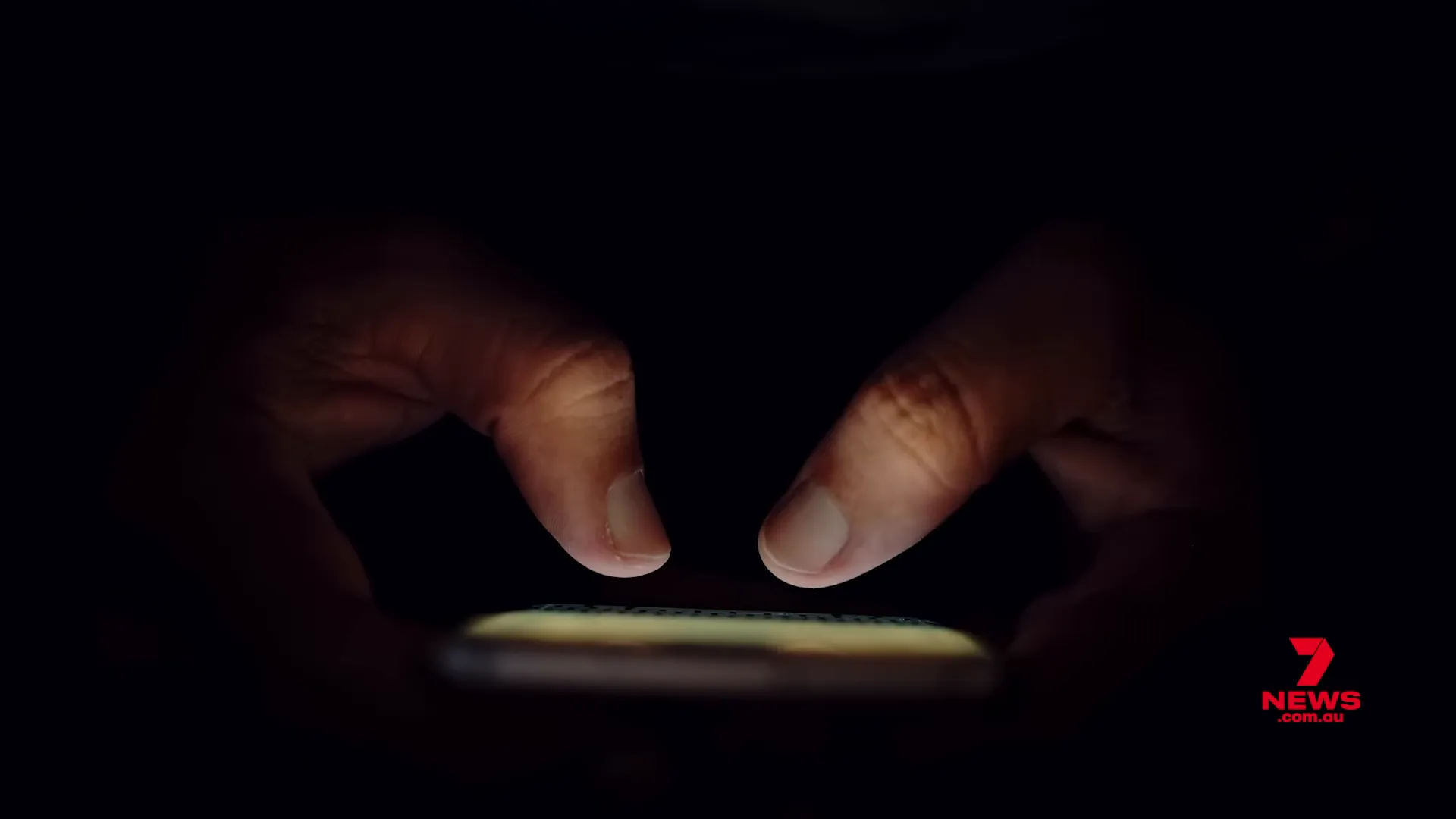 Teen speaking to his father in a bedroom