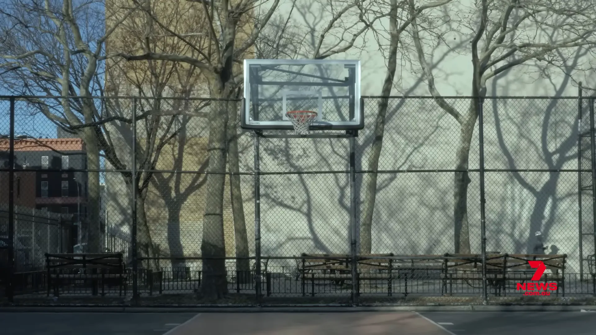 Empty basketball court representing withdrawal from sport