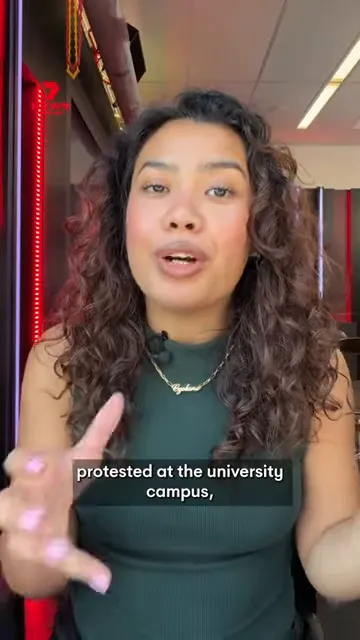 Video screenshot of a person speaking with on-screen subtitle reading 'protested at the university campus'.