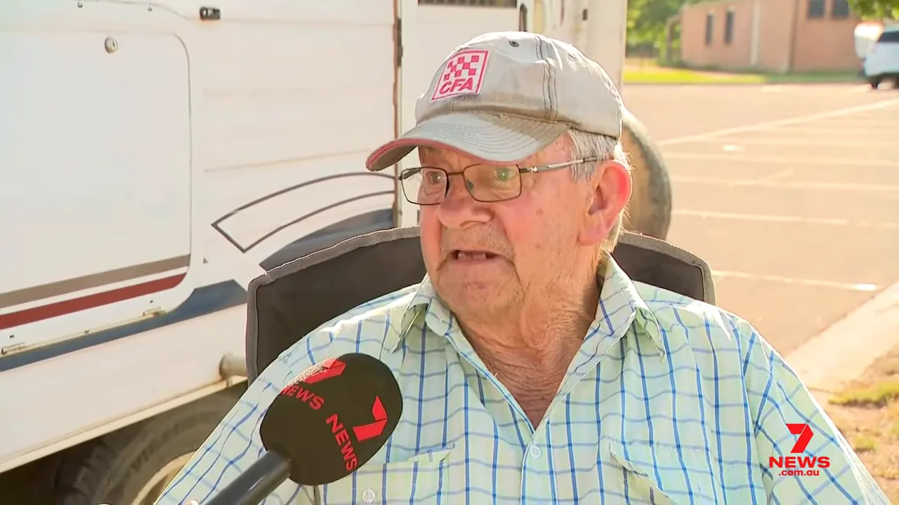 Farmer at a relief centre being interviewed about his family's farm and livestock.