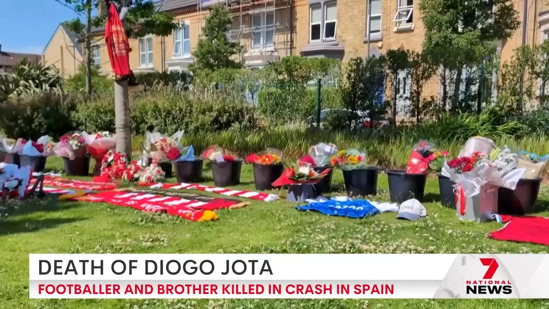 Fans laying floral tributes outside Liverpool stadium