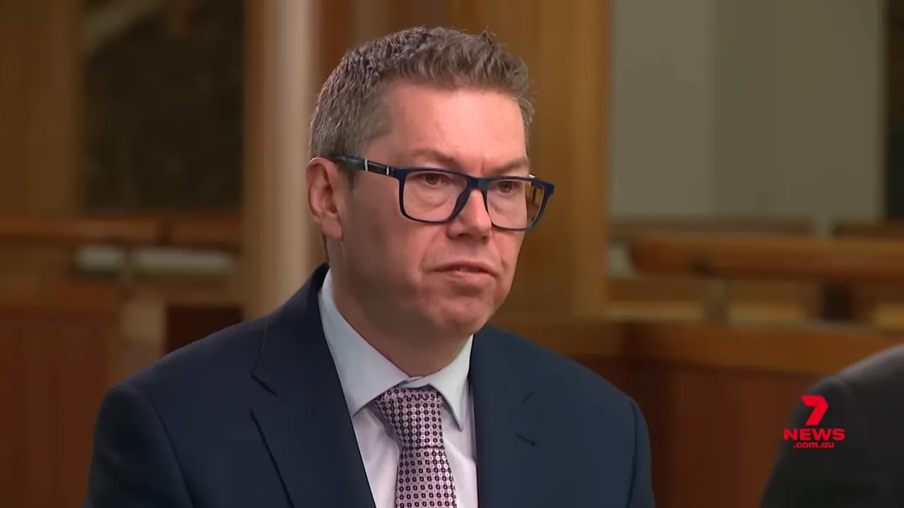 Clear, focused close-up of Pat Conroy speaking calmly during a TV interview, suitable for policy context.