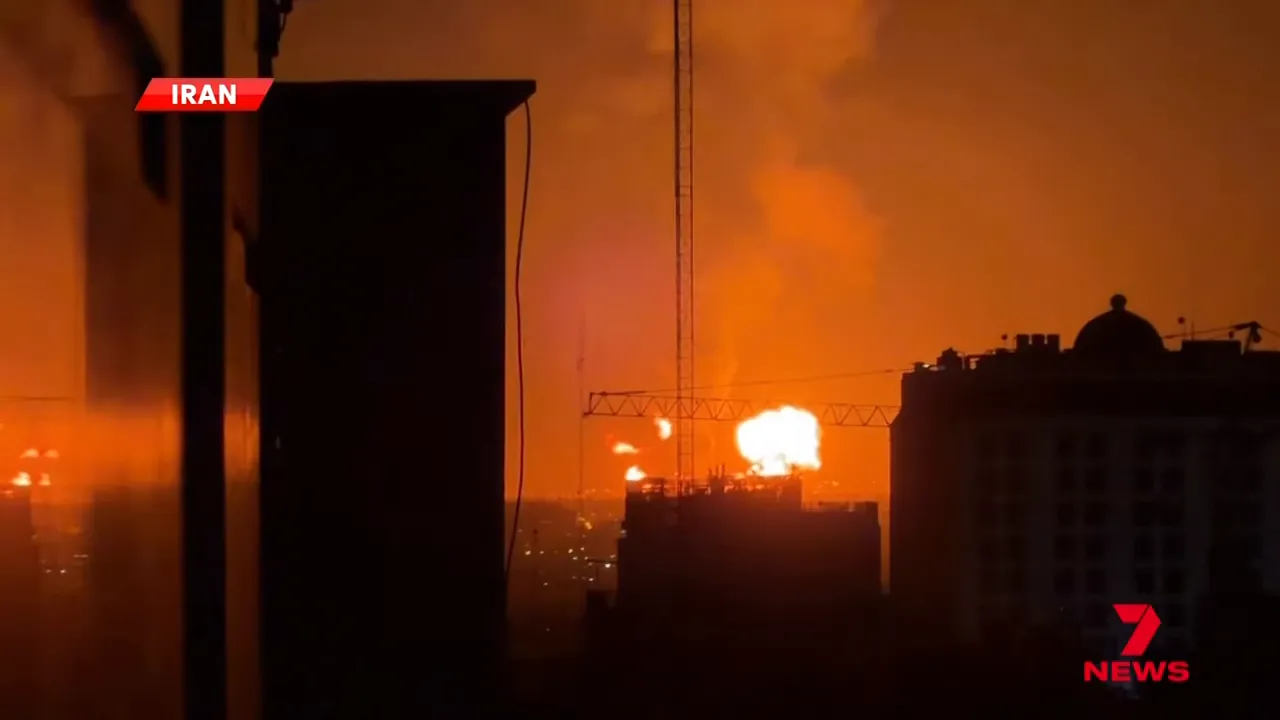 Bright fireball over city with crane and building silhouettes after a strike