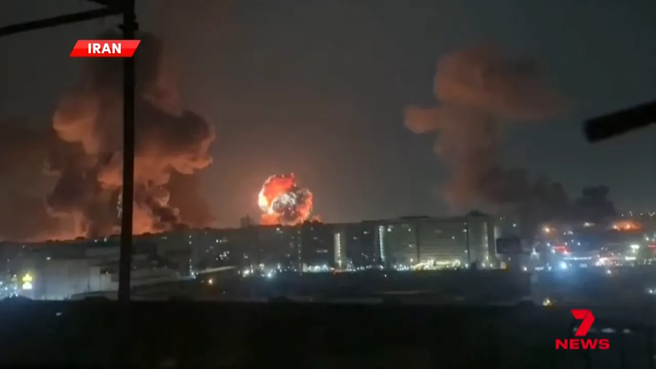 city skyline illuminated by multiple fireballs and large smoke plumes at night