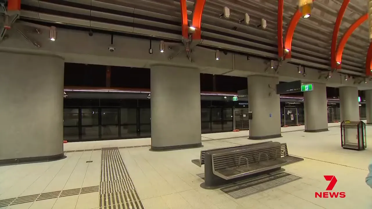 Platform showing passengers and signage indicating east and west directions