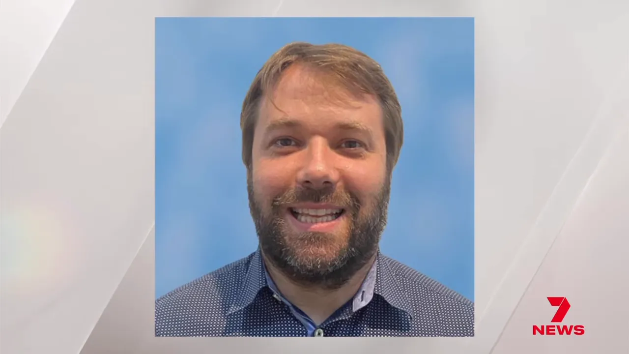High-quality headshot portrait of a man used in a news package