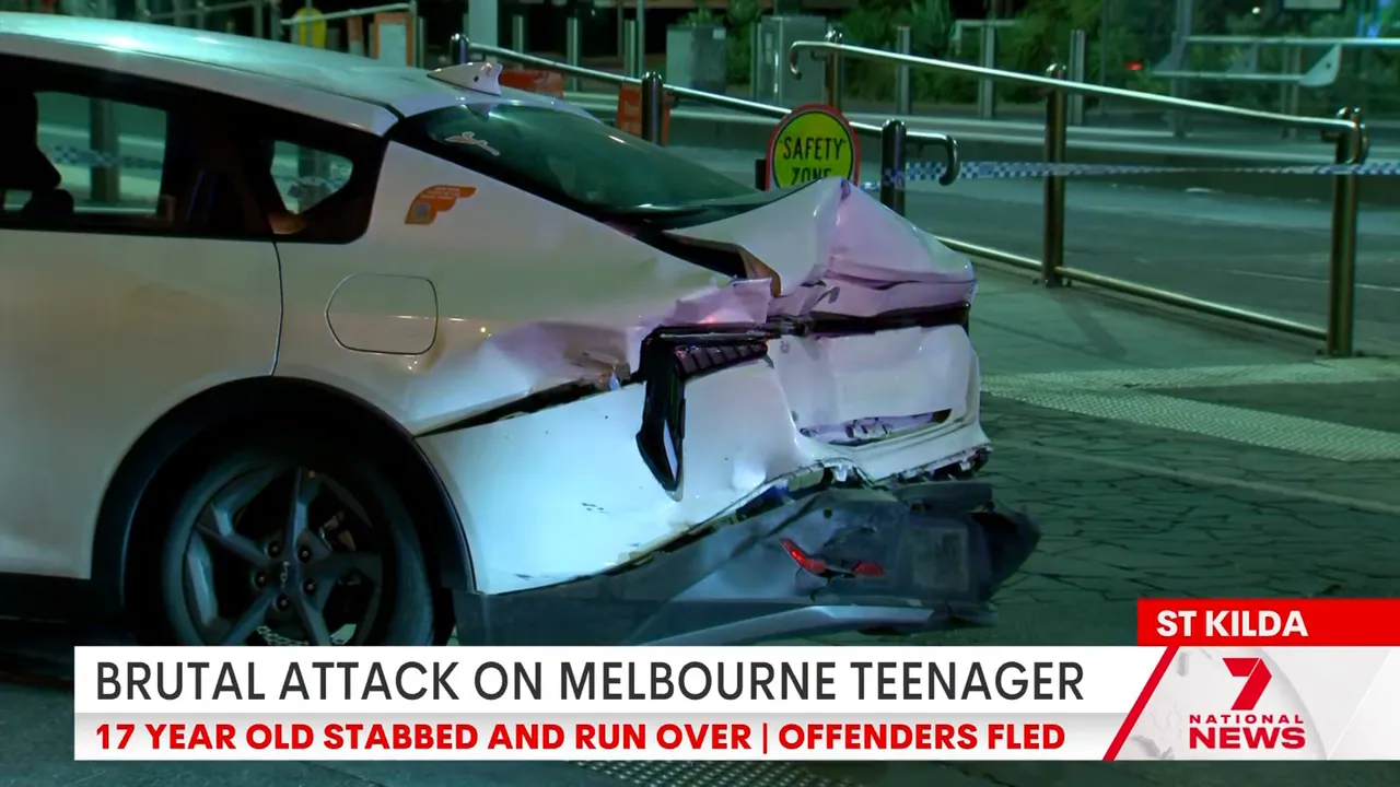 Rear-end damage to a white car at the scene, showing a crushed bumper and broken taillight