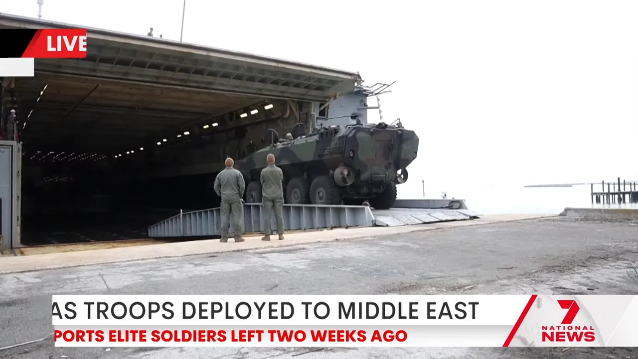 Military transport vehicle inside a hangar during reporting on SAS troops deployed to the Middle East