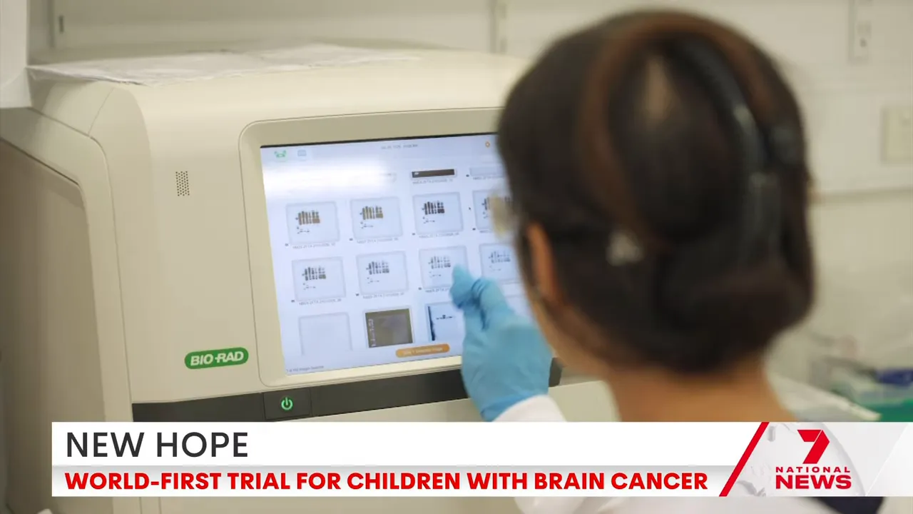Touchscreen of a Bio‑Rad sequencing instrument showing sample thumbnails with a gloved hand pointing.